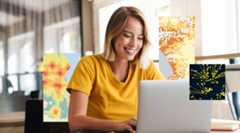 A woman smiles while looking at a laptop, with images of maps superimposed