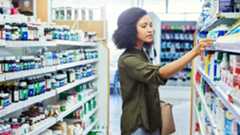 Photograph of Woman Shopping for Medicine