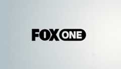 The Fox One logo, featuring FOX in bold black letters and ONE in white letters within a black rounded rectangle, centered on a professional light gray background with subtle geometric patterns.
