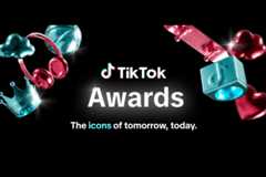 The TikTok Awards logo with the text The icons of tomorrow, today. surrounded by various metallic objects like headphones, a crown, a skateboard, and a camera, all on a black background.