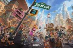 A wide, vibrant movie poster for Disneys Zootopia 2, showing a bustling city street filled with various anthropomorphic animals. In the foreground, characters like Judy Hopps and Nick Wilde are prominent, with a large crowd of other animals behind them. A street sign for Zootopia and a traffic light displaying 2 are visible. The background features a detailed cityscape with mountains in the distance. The bottom of the poster includes the text ONLY IN THEATERS NOVEMBER 26.