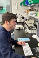 student looking at computer monitor
