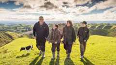 family and dog walking on farm