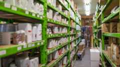 green metal stock shelves with product on them 