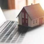 Mini house on a laptop.