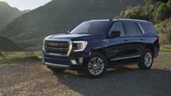 Front-angled view of a black 2024 GMC Yukon