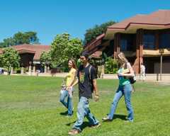 Students walking on the lawn at Kapiolani Community College's campus