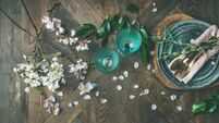 Flat-lay of Spring Easter Table setting with almond blossom flowers