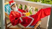 cheerful santa man hold exotic fruit. healthy gift. bearded man healthy eating. merry christmas. happy new year. xmas gifts and