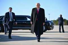 U.S. President Donald Trump walks toward the press to speak with reporters before boarding Air Force One at Fort Bragg, North Carolina, on Friday.