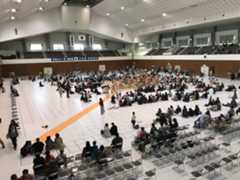 Sumo fans attend a regional tour stop in Uji, Kyoto Prefecture, in April. Sumo tours, or jungyō, allow fans in areas without tournaments to experience the sport up close. | JOHN GUNNING