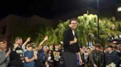 A candidate for governor speaks at a campus