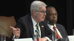 A photo of Patrick speaking.