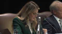 A photo of Prejean Boller speaking into a mic.