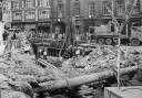Shoppers stop to watch the mammoth building works to culvert the Blakewater many feet beneath Salford Blackburn in 1963.