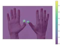 handpose-heatmap-thumbtip – LearnOpenCV Image with probability heatmap of thumb tip superimposed on original image.