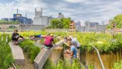 Students making scientific observations next to the Mississippi River in Downtown Minneapolis.