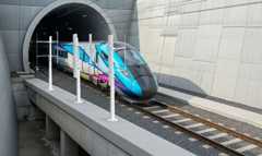 A train leaving a tunnel.