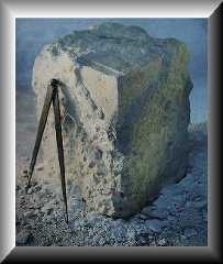A partially chiseled square stone, as an example of a Rough and Perfect Ashlar as it is changed from rough to perfect