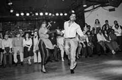 Franking Manning and Norma Miller dancing in front of a crowd.