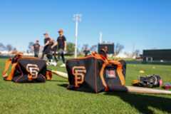 San Francisco Giants Spring Training A bat, gloves and balls rest on the field during the San Francisco Giants spring training at Scottsdale Stadium in Scottsdale, Ariz., on Saturday, Feb. 17, 2024. (Ray Chavez/Bay Area News Group)