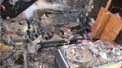 A photo from the Fremont Fire Department depicts the aftermath of a fatal apartment fire that erupted at about 2:53 a.m. on April 6, 2025 in a fourth floor residence at Waterstone Apartments. Investigators reported the possible origin of the fire started after a discarded lit cigarette butt or a butane lighter caught some furniture on fire after one of the occupants fell asleep in the living room. Two women, Lori Long, 62, and Charlotte Holguin, 54, fell to their deaths from a balcony on the fourth story of the building while trying to escape the flames. (Courtesy/City of Fremont)