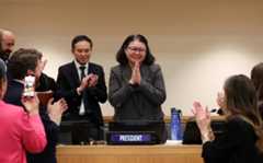 Rena Lee as she announces the conclusion of negotiations. 