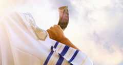 Jewish man blowing the Shofar (horn) of Rosh Hashanah (New Year). Religious symbol