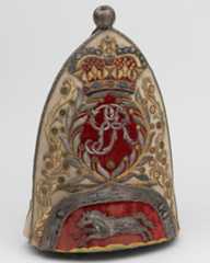 This grenadier cap of the 65th Regiment bears the royal cypher and the white horse of Hanover, c1758