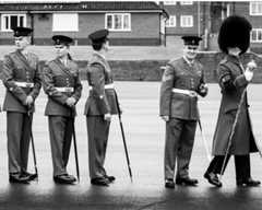 Warrant officers from the Welsh Guards wait to be presented their leeks on St David's Day, 2017