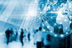 A bustling city street with diverse people walking, showcasing the interconnectedness of the world.