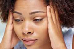 a woman holding her head