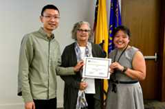 D Chen, D Sandler & J Woo holding an award certificate at the 2024 EB Science Day Awardd