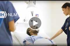 Photo of Dr. Lu presenting the framework for TrialGPT