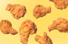 Fried chicken floating on a yellow background