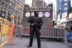 Following bombings in Brussels, a Counterterrorism a police officer patrols...