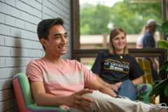 Students sitting in chairs talking