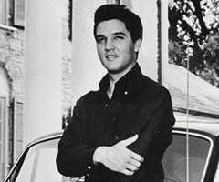 Elvis Presley poses outside his Graceland mansion in 1961 with his first Rolls-Royce – a Phantom V
