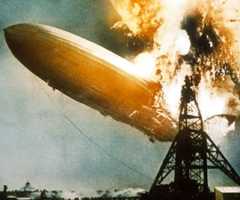 The Hindenburg bursts into flames as it approaches its mooring mast. Thirty-six people died.