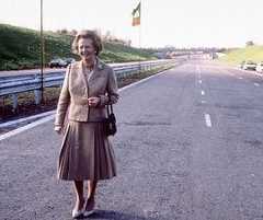 Margaret Thatcher poses on the M25 before cutting a ribbon to open it