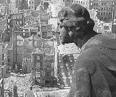 A surviving Town Hall (Rathaus) statue entitled the Allegory of Goodness looks out over the ruins of Dresden
