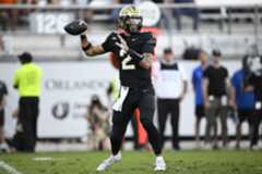 TOS-L-ucf-football-007.jpg UCF quarterback Tayven Jackson looks to throw during the first half of the Knights' game against Oklahoma State on Saturday. (Phelan M. Ebenhack/Special to the Sentinel)