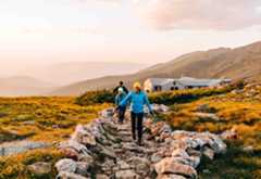 hikers on path outside Lakes of the Clouds hut