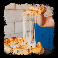 A person lifts a slice of pizza from a deep-dish pie, stretching melted cheese.