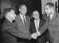 Mayor George Christopher shaking hands with Justin Herman