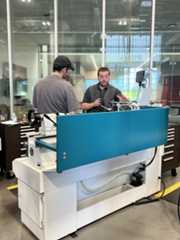Gabe in the PCC OMIC machining shop helping a student.