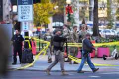 U.S. Marshals and National Guard troops are seen after reports of two National Guard soldiers shot near the White House in Washington, Wednesday, Nov. 26, 2025. (AP Photo/Evan Vucci)