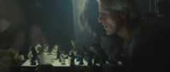 Batty examines Sebastian's chess game.