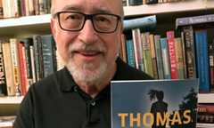 Thomas Perry holding up a book with his name and the title THE BURGLAR on the cover