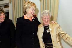 Dr. Loretta Ford alongside Senator Hillary Rodham Clinton, both engaged in a discussion.